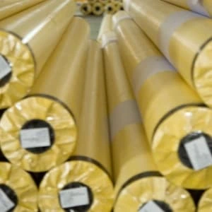 Packaged PVC banner rolls stacked in bulk
