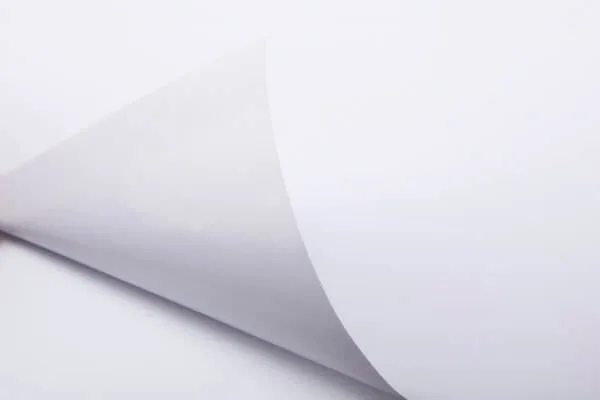 Printable self-adhesive vinyl peeled away from its release liner